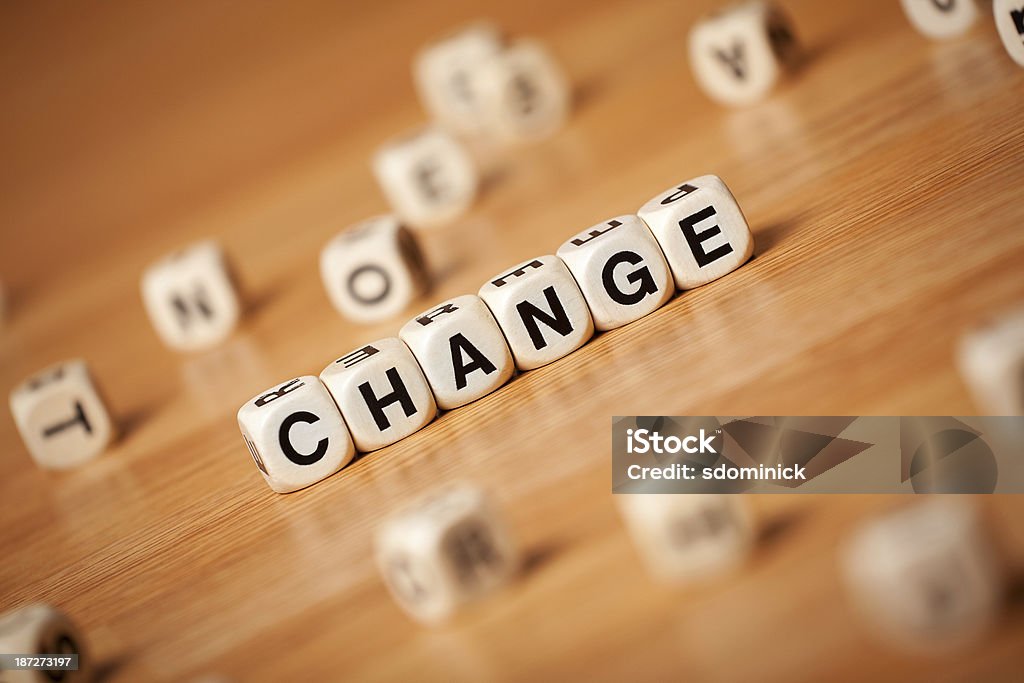 Die Veränderung der geschrieben In Buchstaben Cubes - Lizenzfrei Bauklotz Stock-Foto