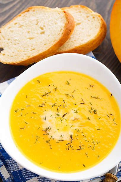 istock Pumpkin soup in white bowl 187274609