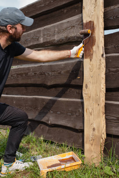 istock Work on restoring a wooden fence 1872748047
