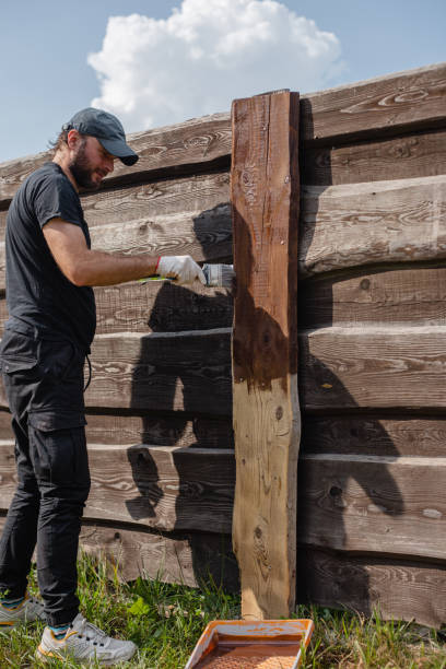 istock Work on restoring a wooden fence 1872748068