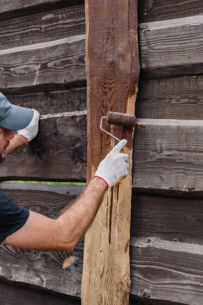 istock Work on restoring a wooden fence 1872748082