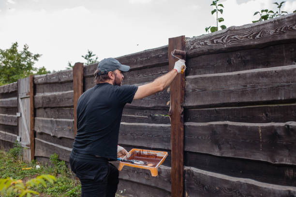 istock Work on restoring a wooden fence 1872748092
