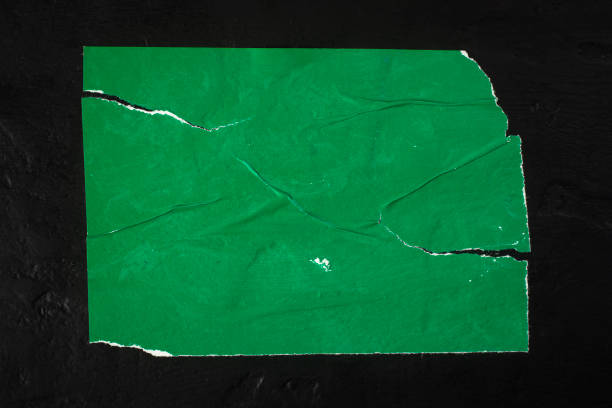 White paper tearing a hole.