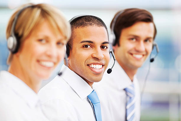 istock Male Call Centre Representative Amidst Colleagues 187275758