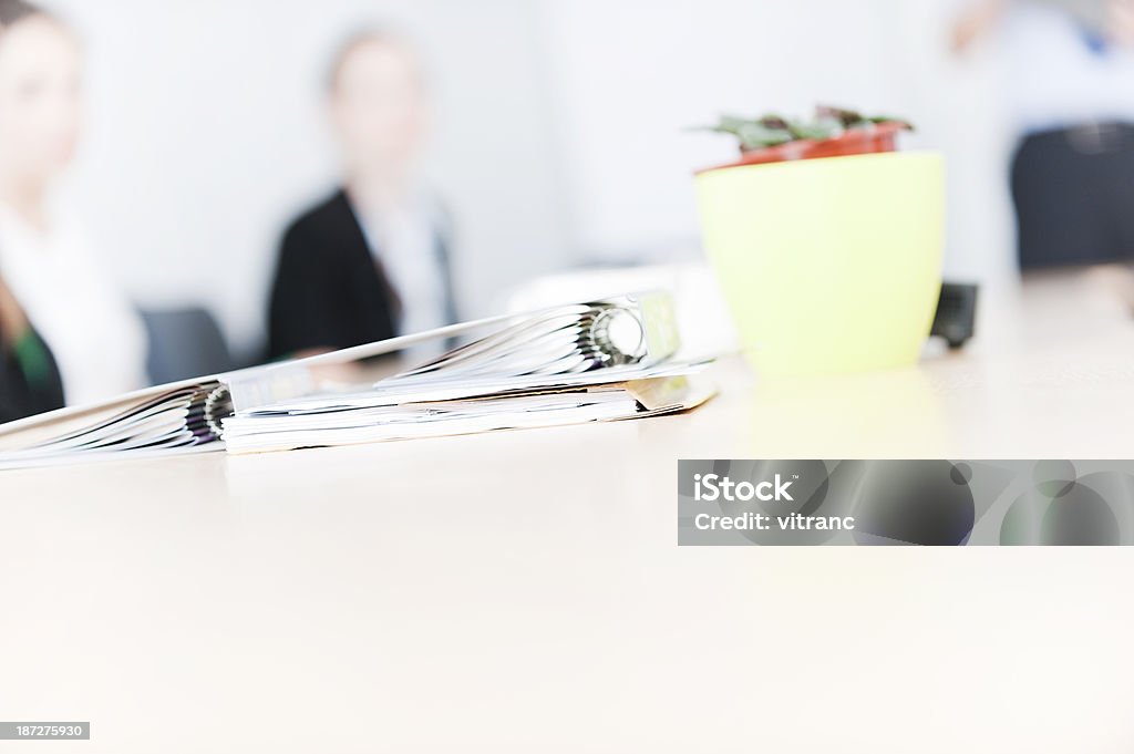 Business team at work Business people around a desk Adult Stock Photo