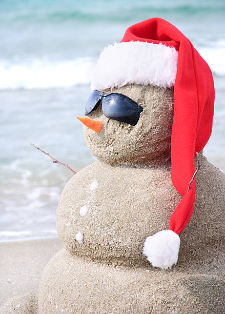 istock Sandy snowman in santa hat. Christmas holiday concept 187276258