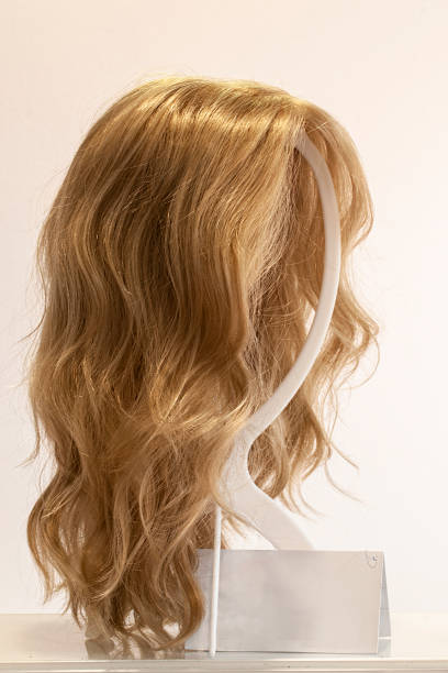 istock Wig with long, slightly wavy and reddish hair 1872774120