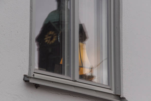 Reflection of a church tower in a window