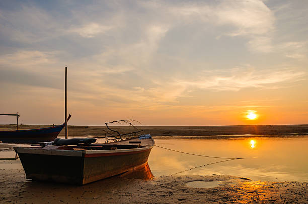 istock Boat at beach and sunset 187280630