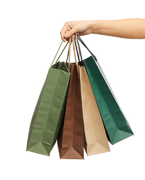 istock woman hands holding shopping bags 187280876