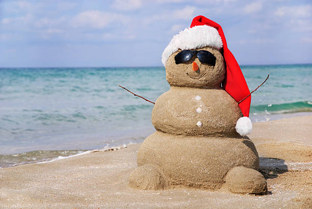 istock Sandy snowman in santa hat. Christmas holiday concept 187281409