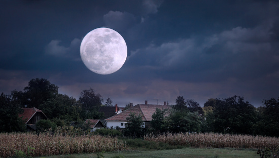 Moonrise over village