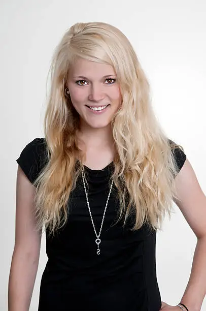 happy smiling young woman with long blond hair