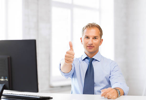 istock smiling businessman showing thumbs up 187286182