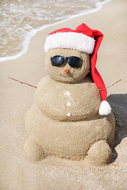 istock Sandy snowman in santa hat. Christmas holiday concept 187286283