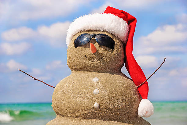 istock Sandy snowman in santa hat. Christmas holiday concept 187286314