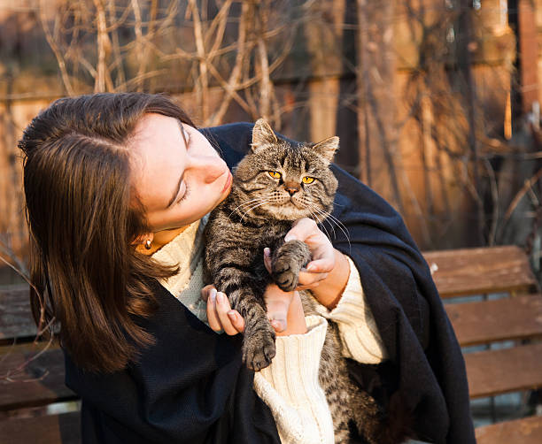 istock young woman with a cat 187286931