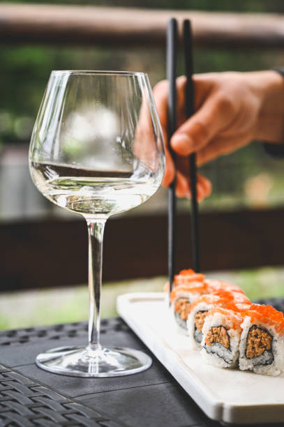 istock eating sushi in a restaurant. 1872885531