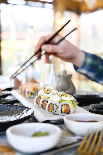 istock eating Japanese sushi in a restaurant. 1872886059