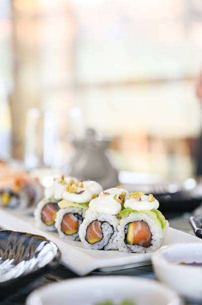 sushi rolls with salmon in a restaurant.