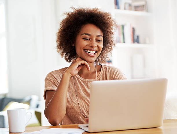 istock Smiling woman with laptop 187288813