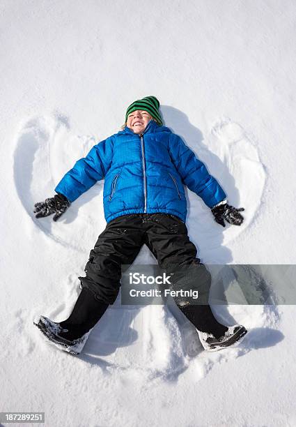 Happy Snow Angel Stock Photo - Download Image Now - Snow Angel, Boys, Cheerful