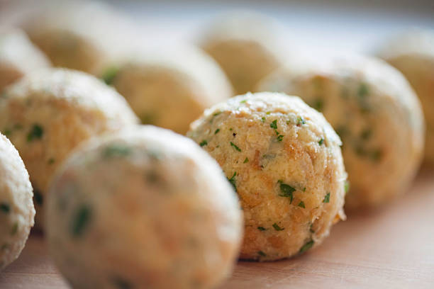istock South tyrolean dumplings in a row on breadboard 187289286
