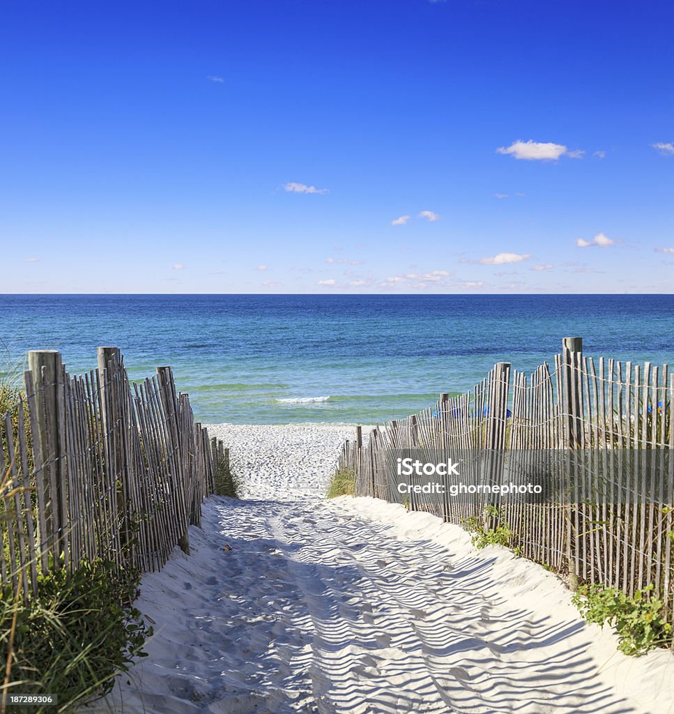 Sandy walkway leading to the beautiful Gulf Shore Beach A clear early morning view of a sandy walkway leading down to the lovely white sandy beaches on the the Gulf Shore in Florida, near Destin. Florida - US State Stock Photo