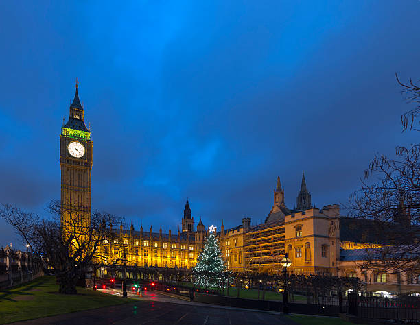 istock Big Ben in London with Christmas tree at dusk 187289519