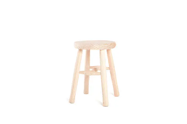 Wooden little stool isolated on white.