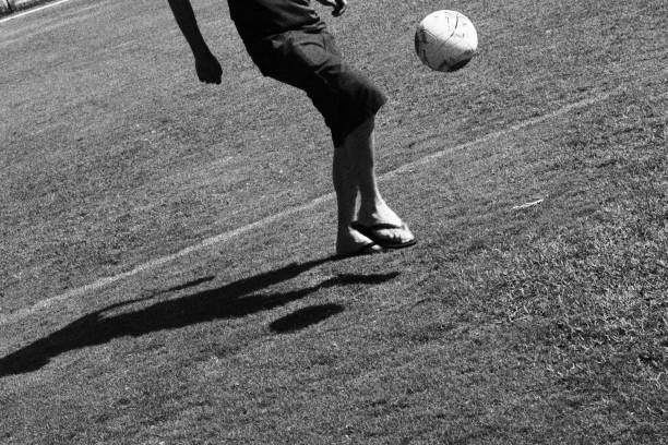 istock Man Playing Football. Monochromatic Black and White Tones 1872897451