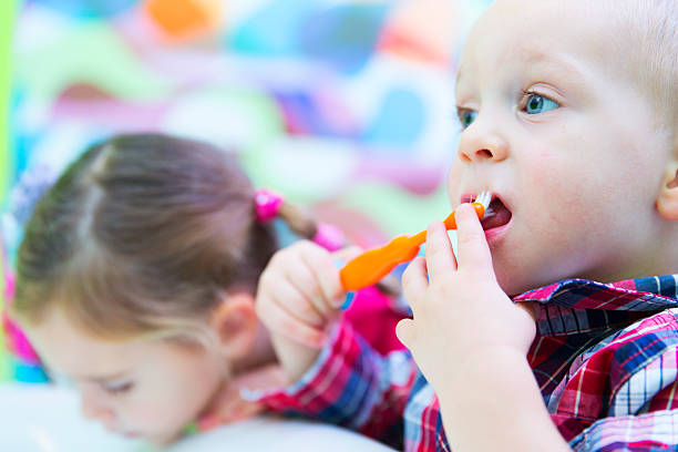 istock Little boy and his sister brushing teeth 187289780