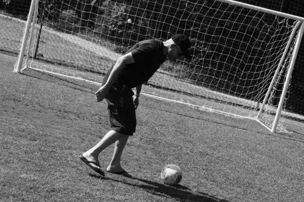 istock Man Playing Football. Monochromatic Black and White Tones 1872903984