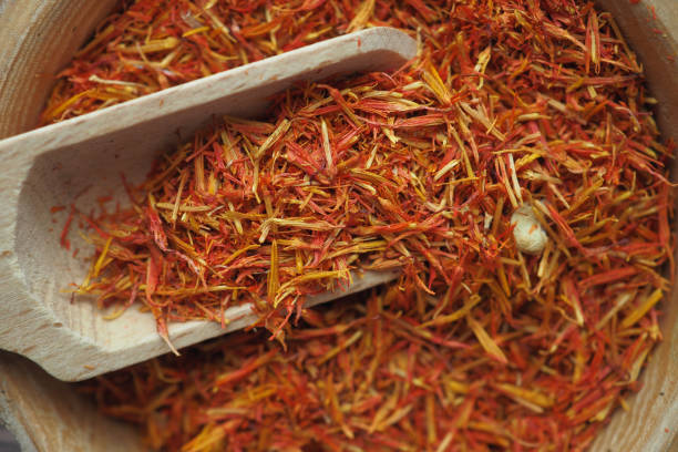 istock Dried safflower in wooden bowl 1872927651
