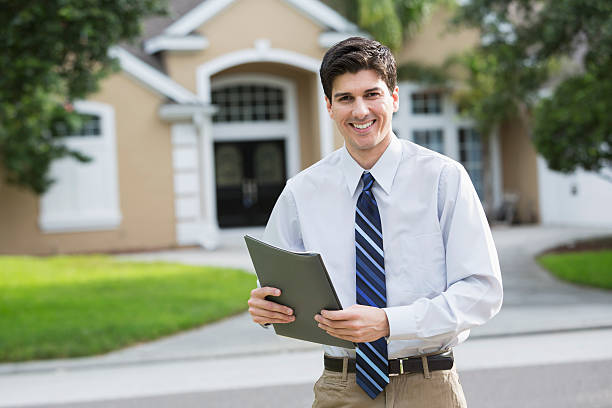 istock Man standing in front of house 187293051