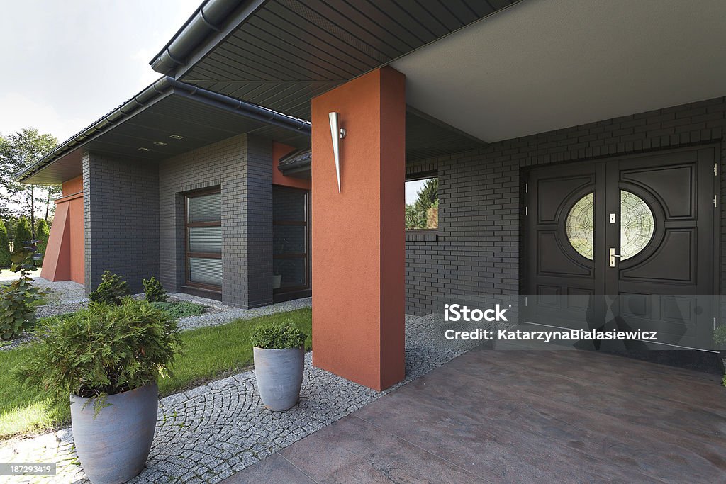 Entrance to a huge house Entrance to a huge house- wooden door Building Exterior Stock Photo