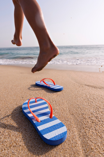 Legs and flops on the beach