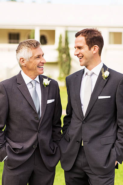 istock Groom And Father Standing Together With Hands In Pockets 187296493