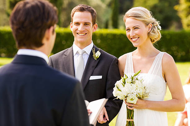 istock Couple Looking At Minister During Wedding Ceremony 187297418