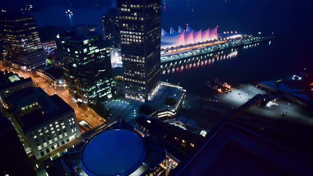 Aerial view of Canada Place and city harbour in Vancouver at night
