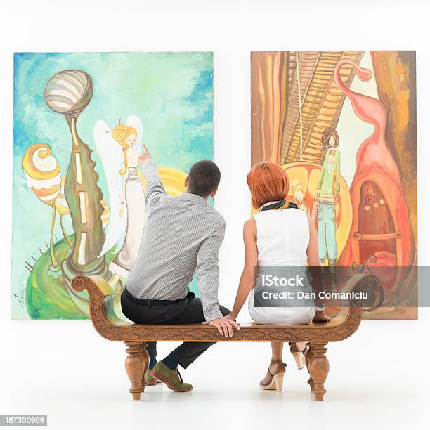 Couple Talking About An Artwork Stock Photo - Download Image Now - Exhibition, Museum, Painting - Art Product