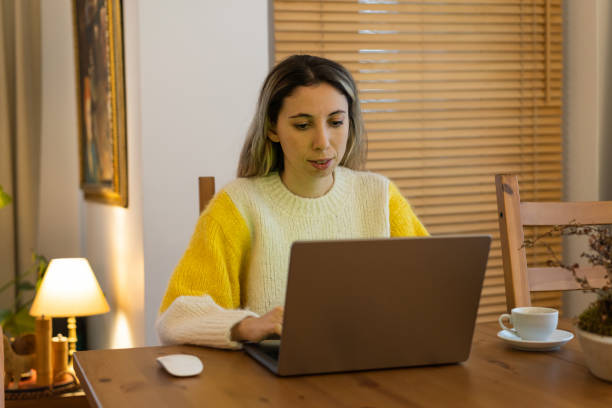 istock Woman working on laptop online 1873024639