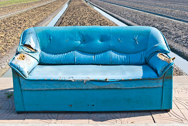 istock Abandoned vintage blue sofa on the street 187303350