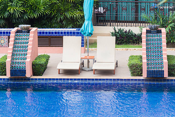 istock wooden bed beside the pool 187303757