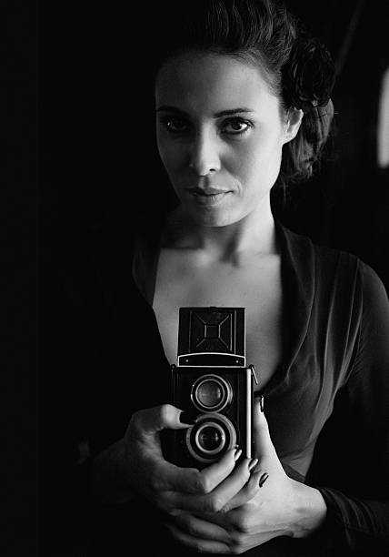 istock vintage camera photographer 187304368