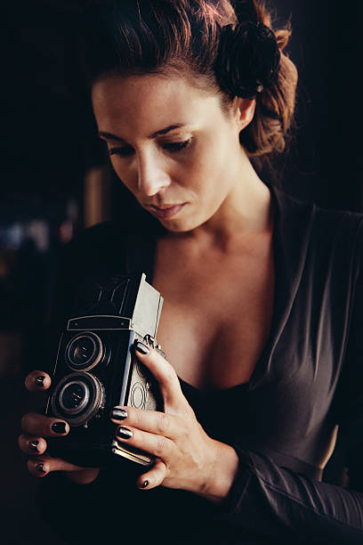 istock vintage camera photographer 187304438