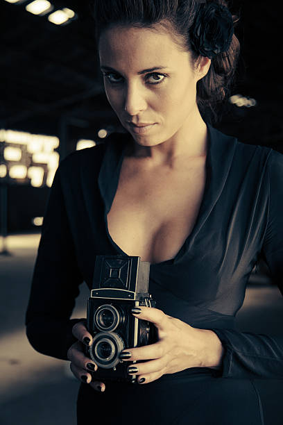 istock vintage camera photographer 187304726