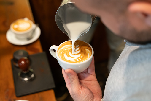 Barista make coffee cup latte art stock photo