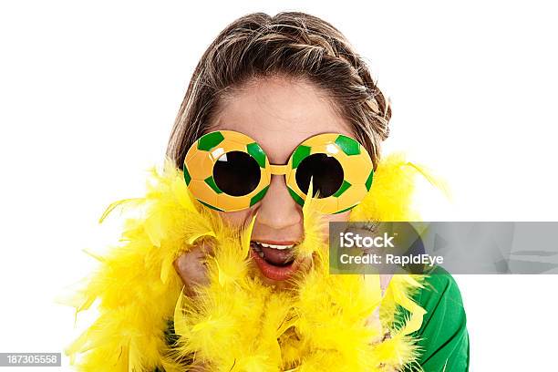 Excited Female Sports Fan Cheers On Her Soccer Team Stock Photo - Download Image Now