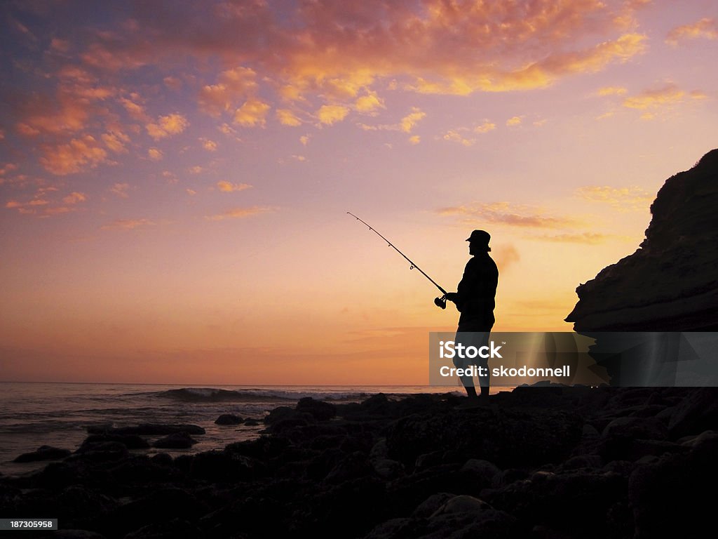 Fishing at Sunset This is a photo of a man fishing in Mexico at Sunset. Back Lit Stock Photo